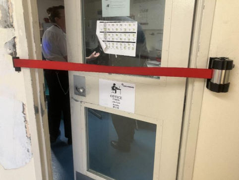 Some of the offices were barred by red tapes, preventing inmates from consulting staff, noted inspectors when they visited Harmondsworth IRC in February 2024 | Photo: HM Inspectorate of Prisons
