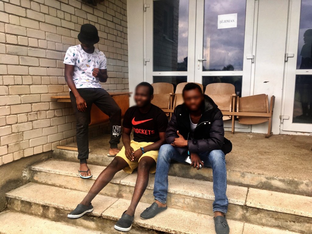 Christian (seated, center) claims to have fled the DRC because of his commitment against discrimination against members of the LGBT community.  Credit: InfoMigrants.