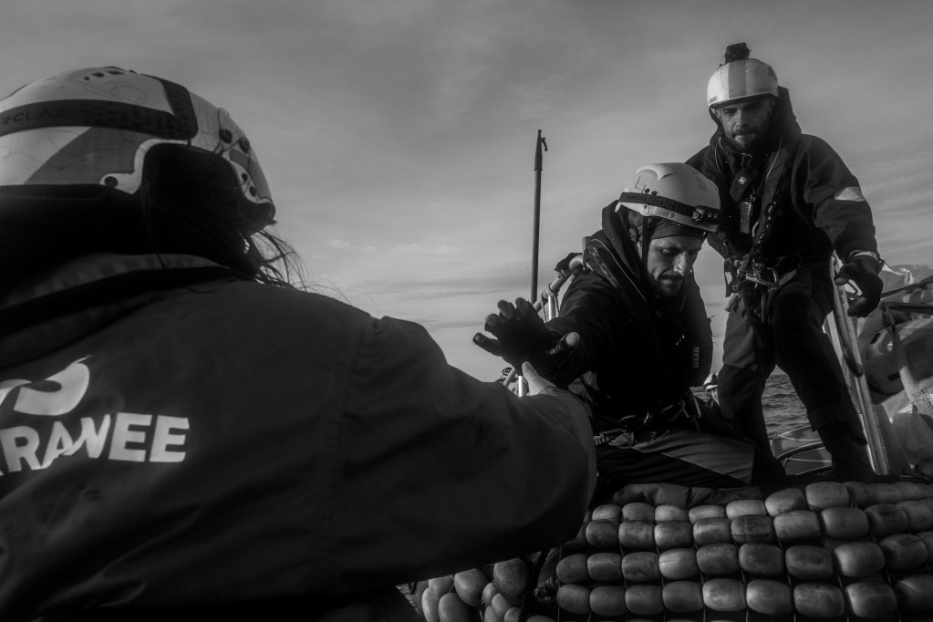 A rescue exercise on board the RHIB. Giannis, team leader of the Easy Two, reaches out to grab Cate and transfer her to the boat while Astoun repeats the instructions in Arabic as if it was a real rescue. December 22, 2022 | Photo: Michael Bunel