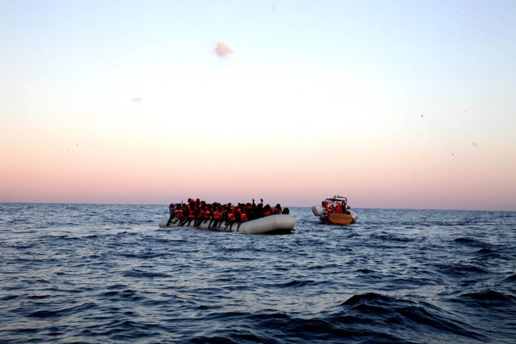 Crew from the Geo Barents near an overcrowded rubber dinghy on January 21 | Source: MSF Press release