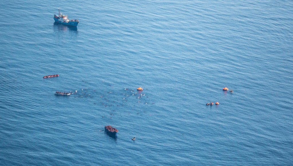 A picture taken from the Moonbird aircraft shows the Iuventa and people in danger in the Mediterranean Sea | Source: Iuventa10