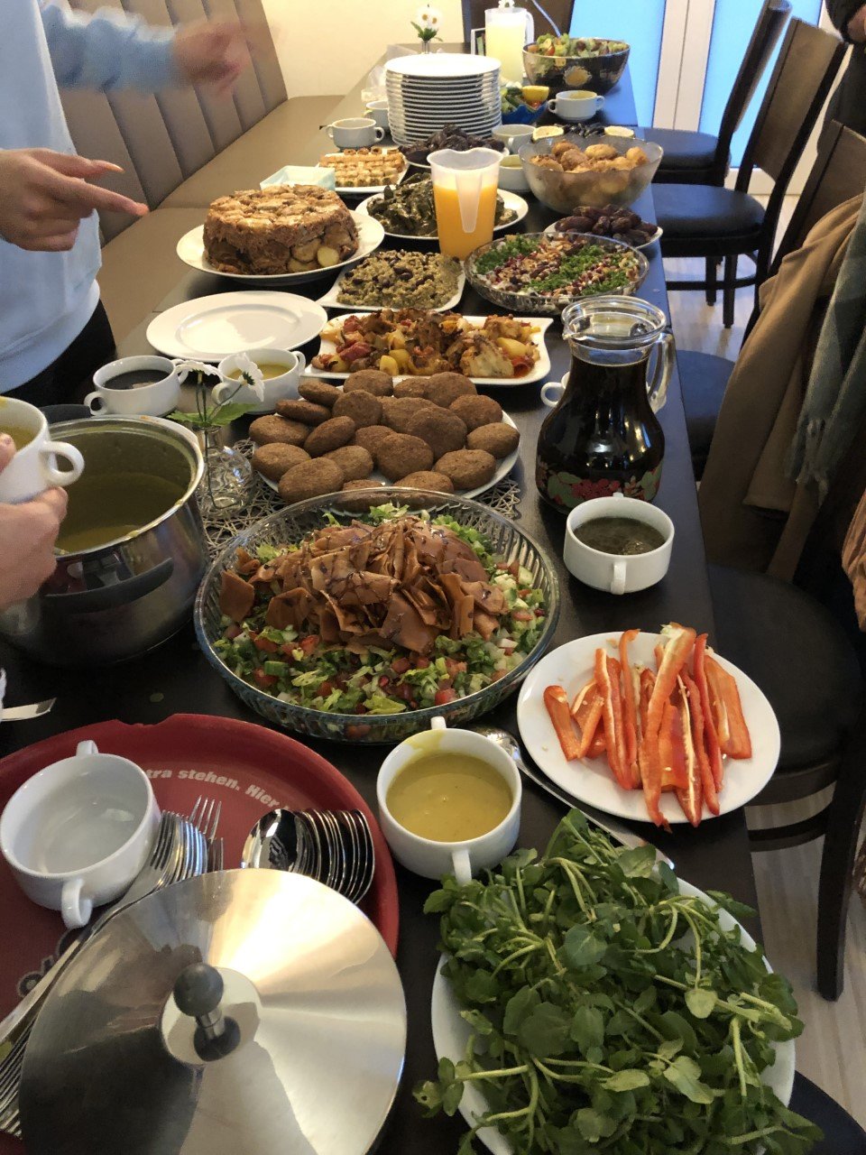 Migrants and refugees come to the SAM International cafe in the center of Sinsheim to celebrate Iftar or the breaking of the Muslim Ramadan fast with traditional Mideastern cuisine | Photo: Courtesy of SAM International.
