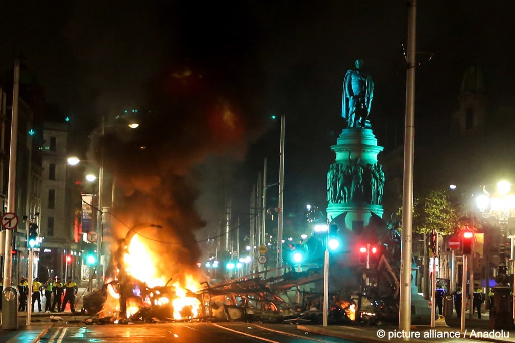 A vehicle in flames in O'Connell Street after violence broke out following five people were wounded in a stabbing attack, including three children and a woman, in Ireland's capital Dublin on November 23, 2023. Stringer / Anadolu