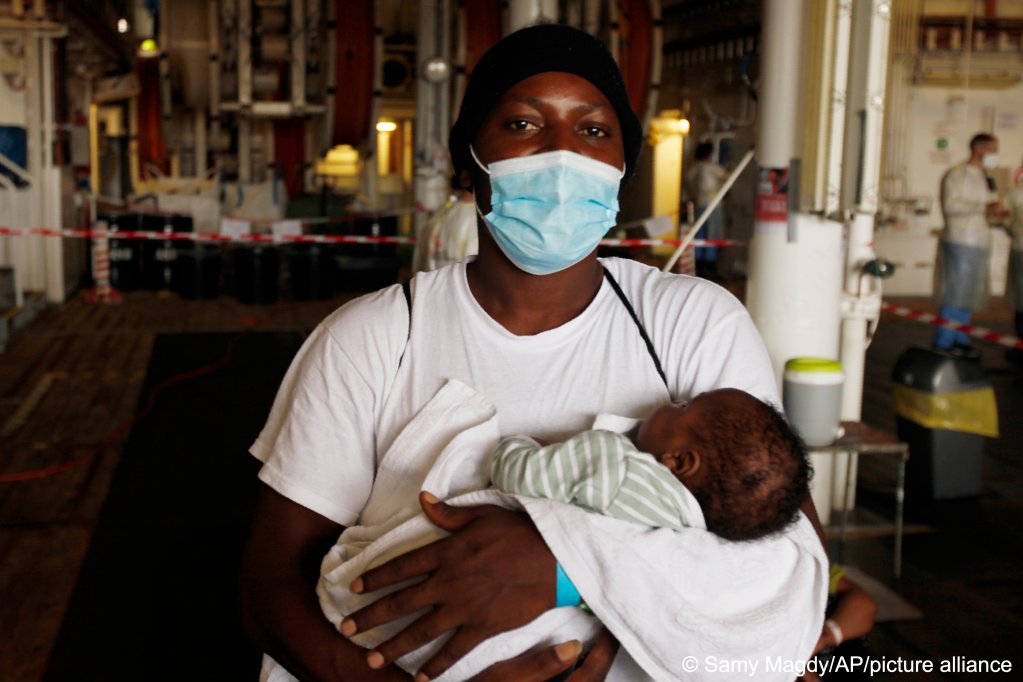 A migrant with his 7-week-old baby onboard the Geo Barents at the port of Augusta in Sicily, Italy, on September 29, 2021 | Photo: AP Photo/Samy Magdy