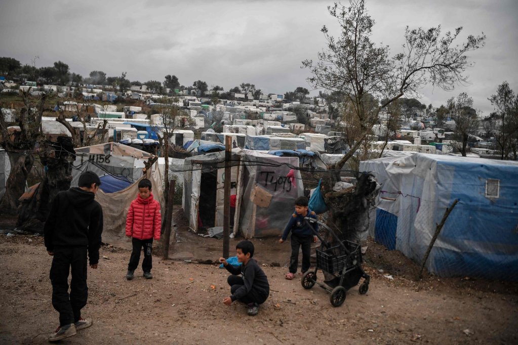 Children playing at the overcrowded Moria migrant camp on the Greek Aegean island of Lesbos | Photo: AFP/LOUISA GOULIAMAKI