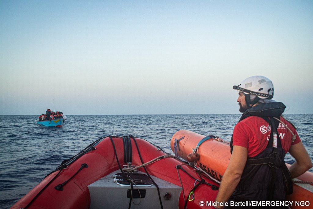 A Life Support crew member is looking at a boat carrying migrants in the Central Mediterranean on August 17, 2026 | Photo: Michele Bertelli/EMERGENCY NGO
