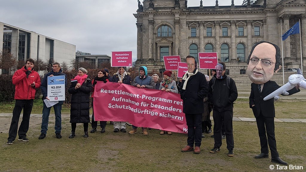 Ruth Dirks and other NesT mentors present a petition against the suspension of Germany’s resettlement program outside the Reichstag building on 18 November 2025 | Photo: Tara Brian