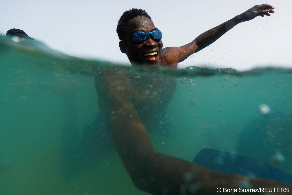 Broad smiles are evident on the faces of migrants taking part in the project | Photo: Borja Suarez/Reuters