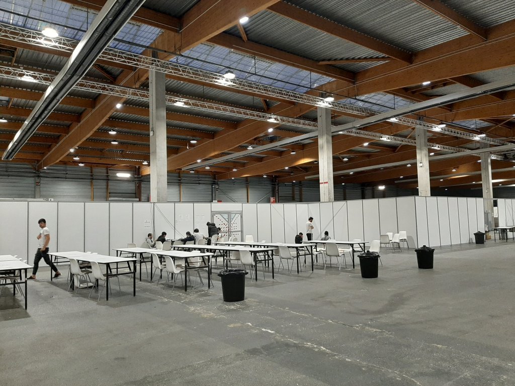 The interior of the exhibition hall at the Paris Event Center, which is housing 419 migrants. Credit: InfoMigrants