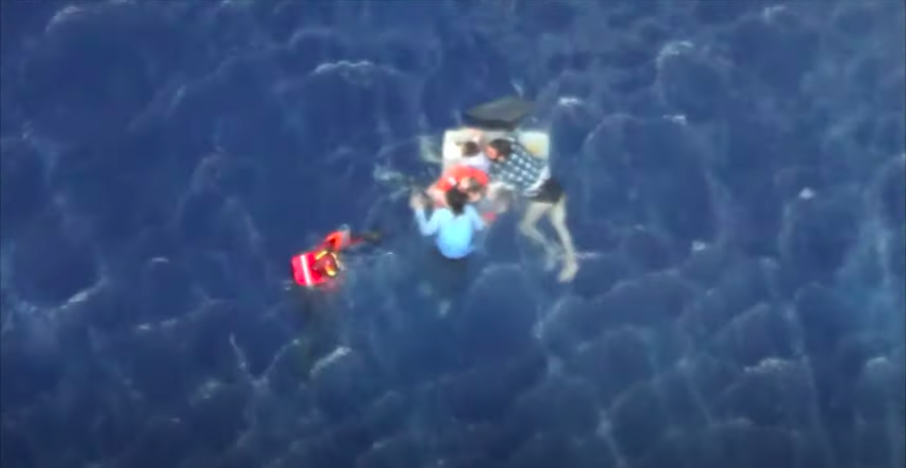 Migrants are helped to safety in a Greek coast guard helicopter rescue on August 26, 2020 | YouTube screenshot/Hellenic Coast Guard