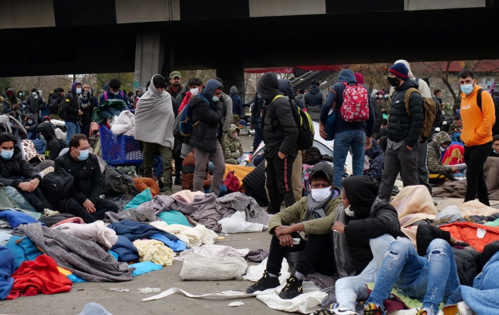 Migrants await evacuation from the Saint-Denis camp on November 17, 2020. Credit: Reuters