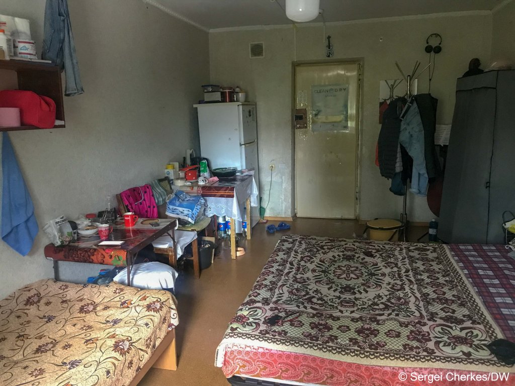 The small room which Sergei now shares with his mother and grandmother in Dnipro after they were displaced due to the Russian occupation of their home city Melitopol | Pieces of a broken Ukrainian tank in Melitopol which the Russian army now occupies | Photo: Sergei Cherkes / InfoMigrants / DW