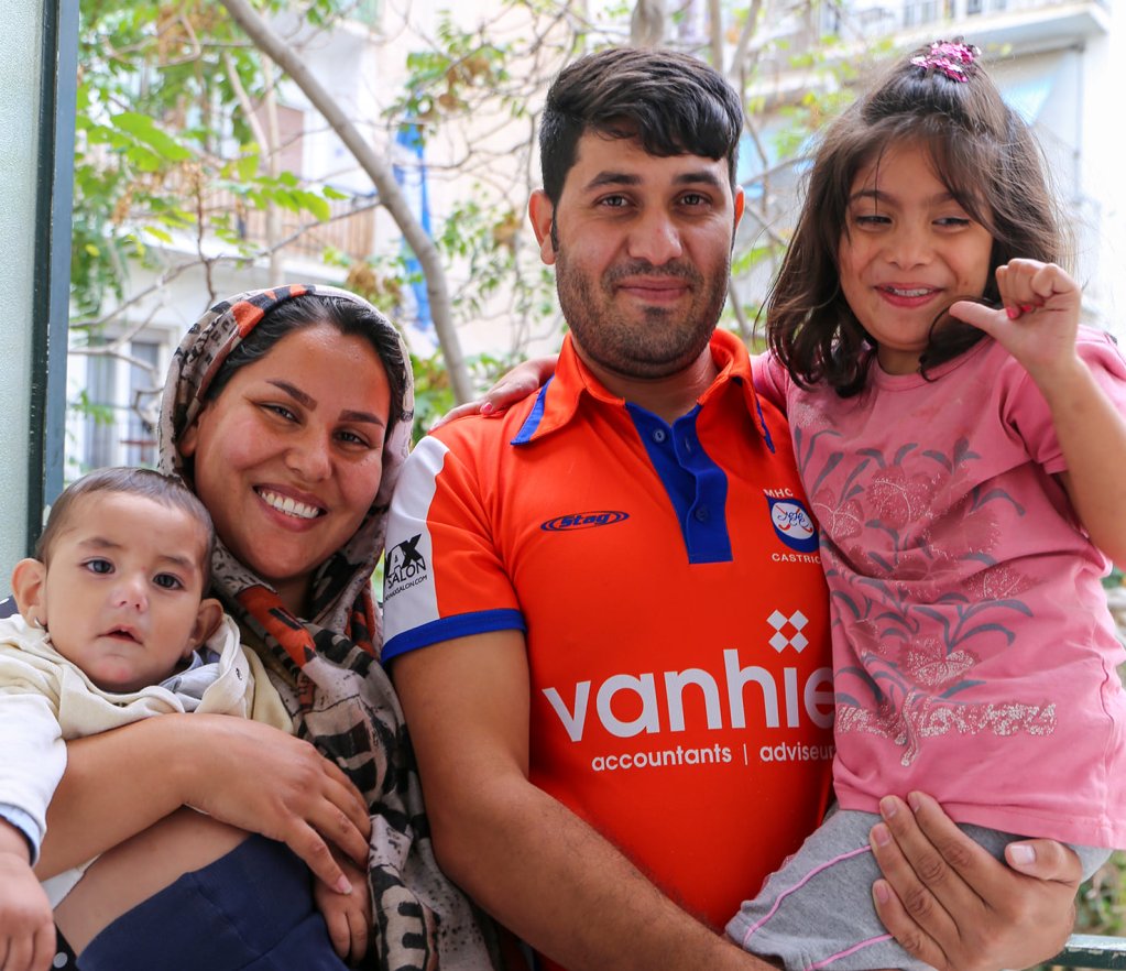 A picture of a family who benefited from the EU relocation program tweeted by IOM Greece | Source: @IOMGreece