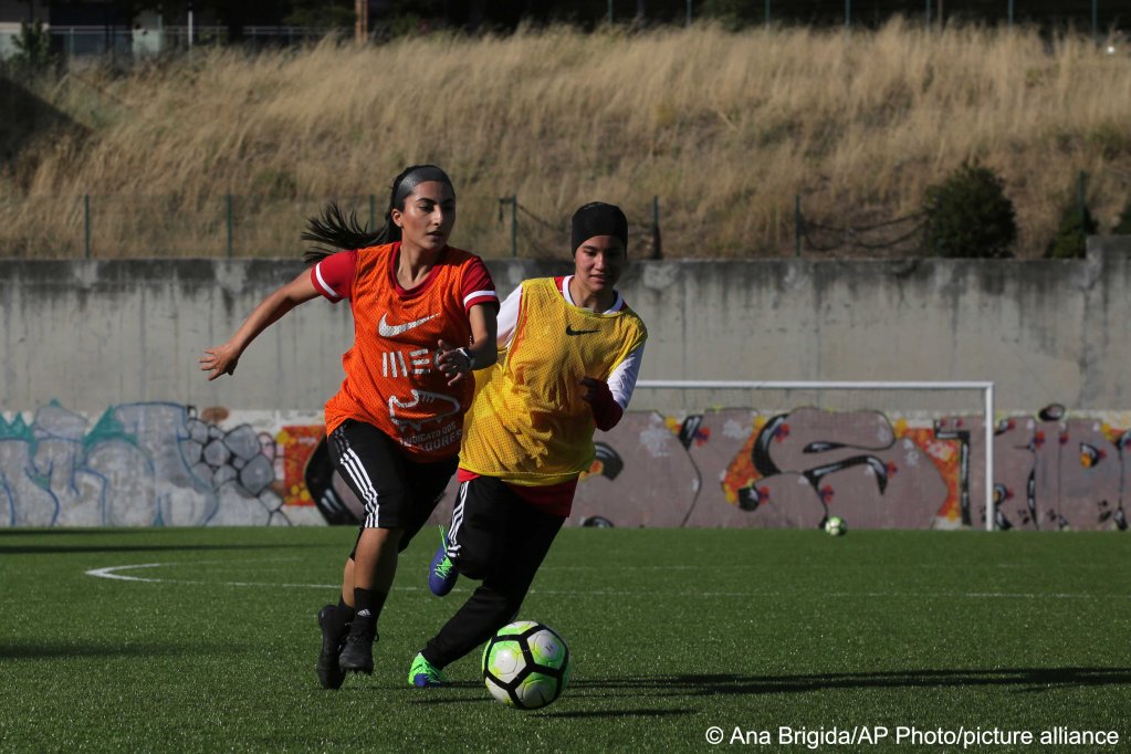 Farkhunda Muhtaj, left, the captain of the Afghanistan women's national team at a soccer pitch in Odivelas, outside Lisbon, on September 30, 2021 | Photo: Ana Brigida/AP Photo/picture-alliance