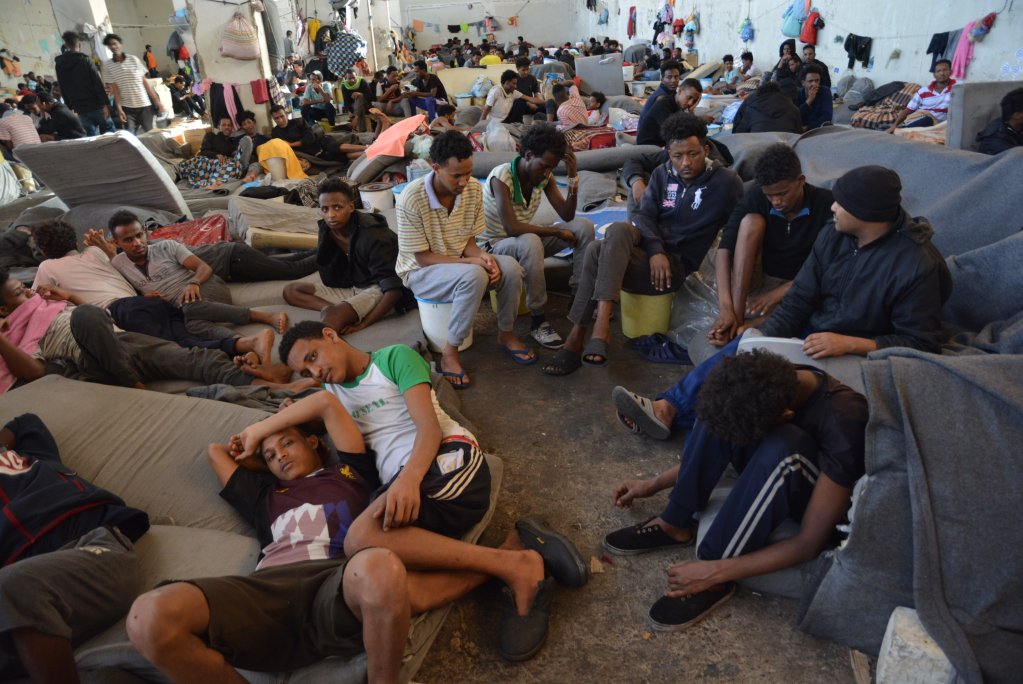 Refugees in Dhar al-Jebel detention center in the main warehouse where 700 of them were detained. | Photo: Jérôme Tubiana/MSF