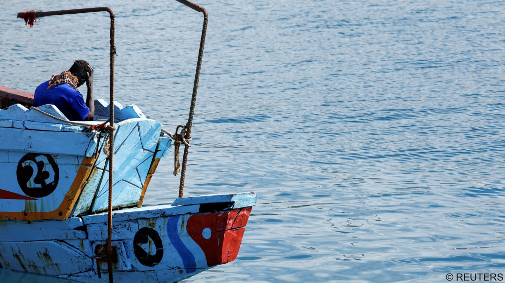 A migrant waits to disembark from a Spanish coast guard vessel, in the port of Arguineguin, on the island of Gran Canaria, Spain, September 4, 2023. REUTERS/Borja Suarez