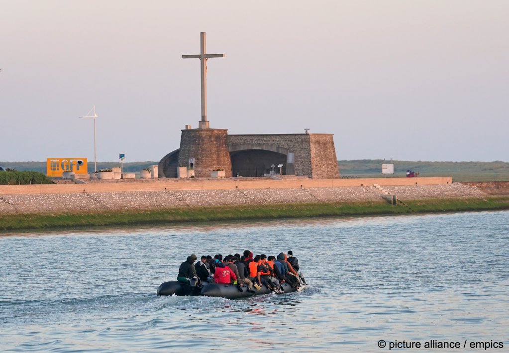 A migrant is heard shouting 'this is for Rishi Sunak' as the boat he is traveling on, makes its way down a canal towards the sea in France | Photo: Gareth Fuller / picture alliance / empics