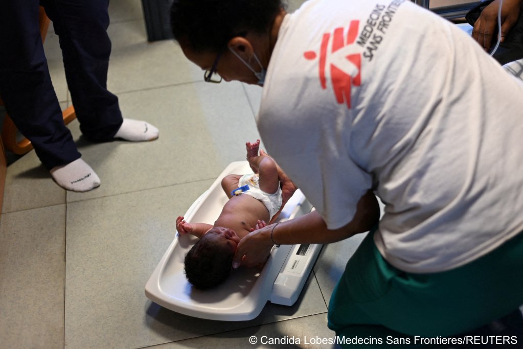Baby Ali* being weighed and checked by the MSF medical team on board the Geo Barents | Photo: Candida Lobes / MSF / Reuters