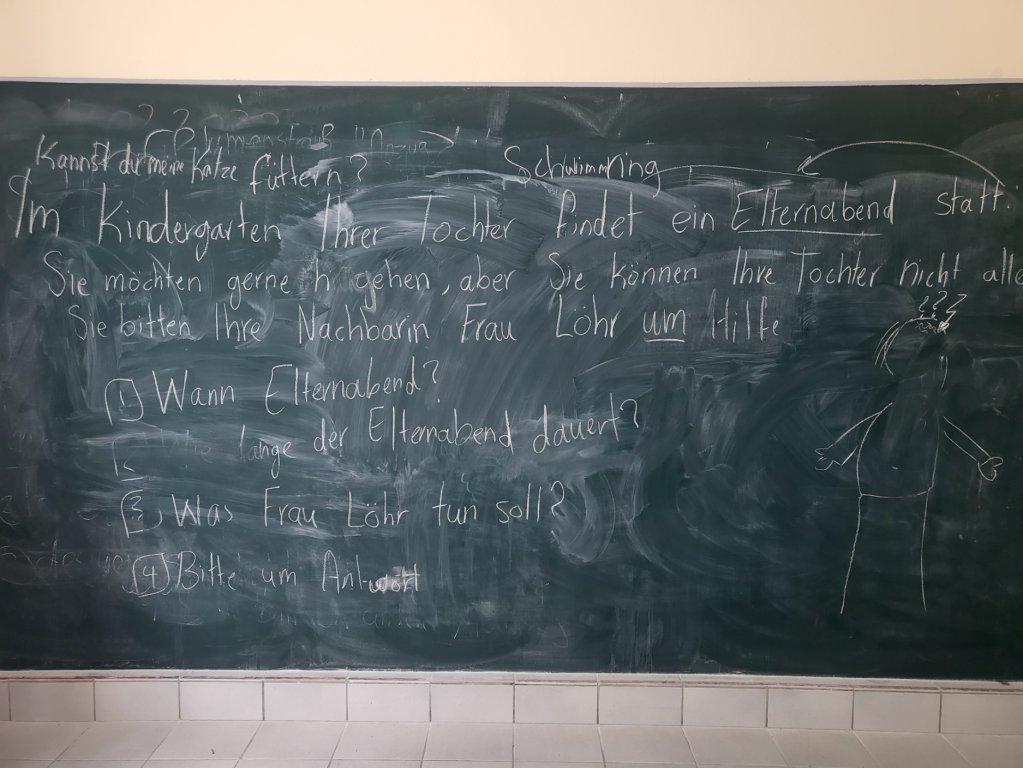 A chalkboard full of German words from a language lesson at the Caritas shared accommodation facility for Yazidis in Bad Saarow, eastern Germany | Photo: Benjamin Bathke/InfoMigrants