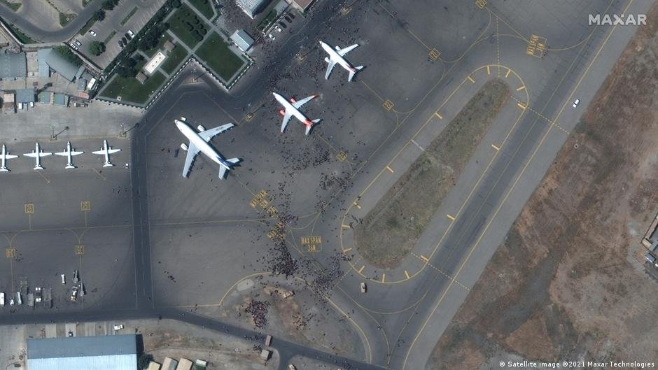A satellite image from earlier this week shows crowds of people at the airport desperate to board a flight | Source: Satellite image, Copyright 2021 Maxar Technologies