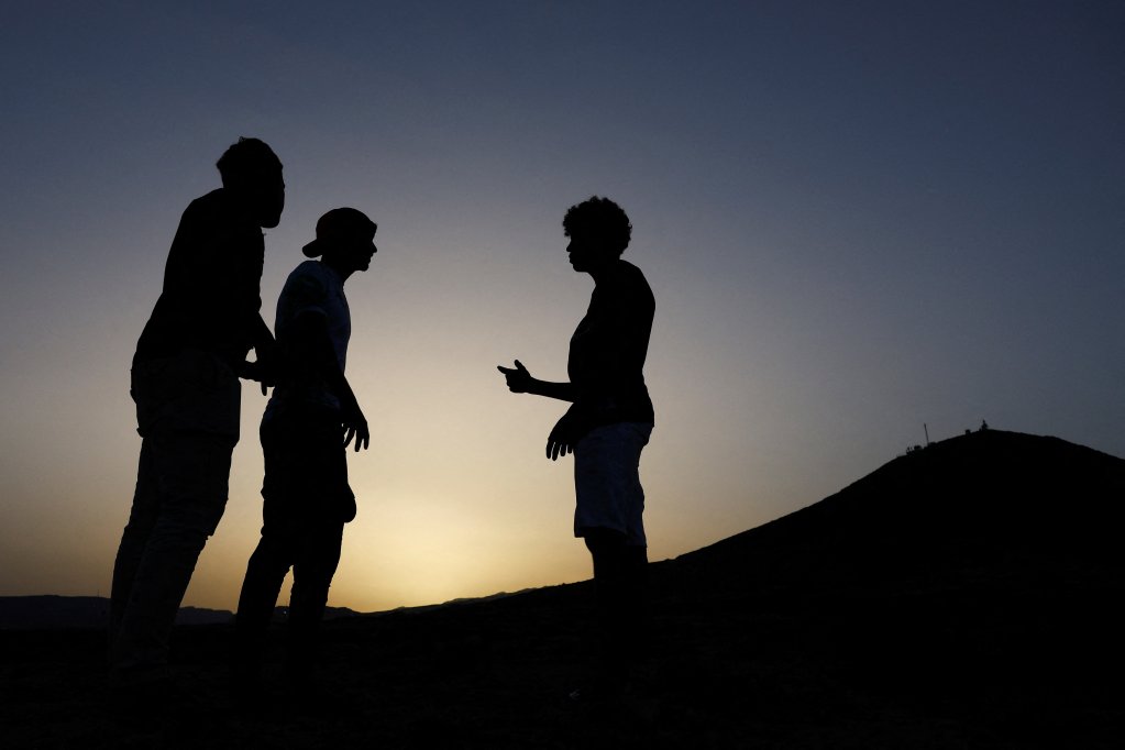 Three Moroccan minor migrants talk before entering the Arinaga juvenile center, on the island of Gran Canaria. Spain, July 11, 2024. REUTERS/Borja Suarez