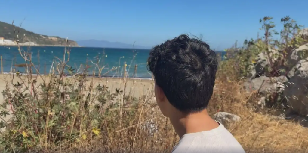 Screenshot of Omar looking out to sea from the DW report | Source: DW