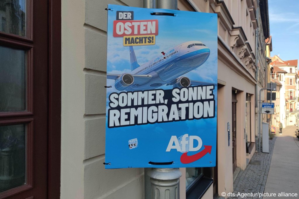 AfD election poster that reads "The East does it! Sommer, sun, remigration"; "deportation-Hansa” is written in small letters on the airplane in reference to German carrier Lufthansa | Photo: dts-Agentur/picture-alliance