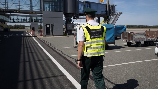 A Latvian state border guard at work at Riga airport | Source: Press office, Latvian State Border Guards