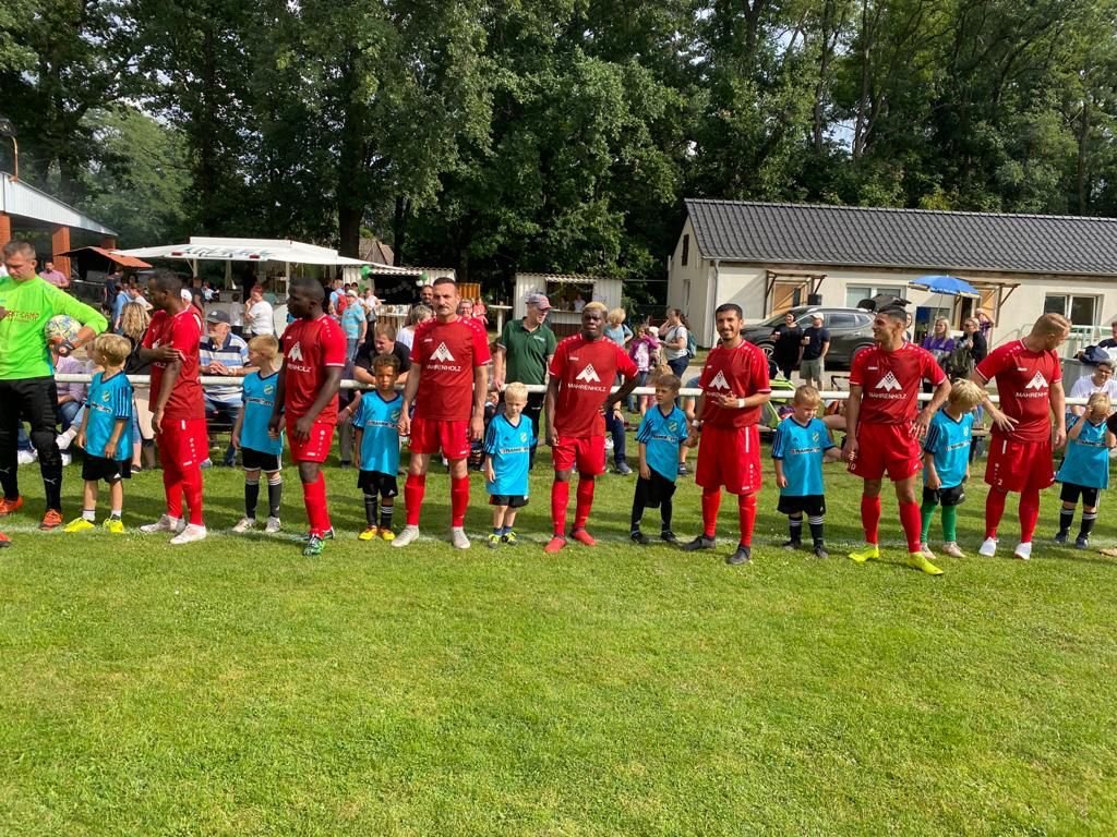 Dheyab Ali (third red player from left) before a match of his soccer club in Bad Saarow, eastern Germany | Credit: FSV Preußen Bad Saarow
