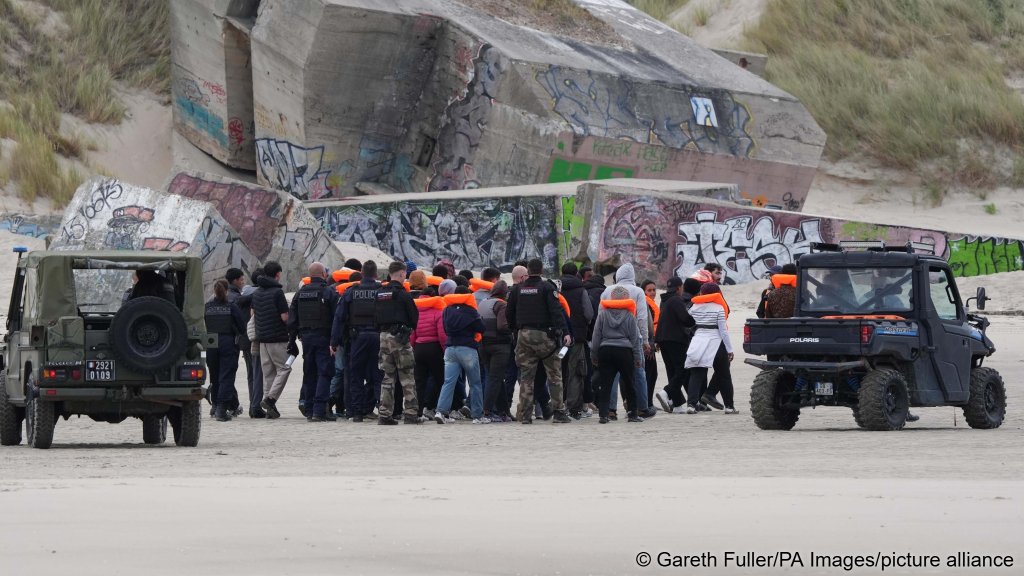 French police detain a group of people thought to be migrants on the beach at Berck, France, to prevent an attempt to cross the English Channel on June 15, 2026 | Photo: Gareth Fuller/PA Wire