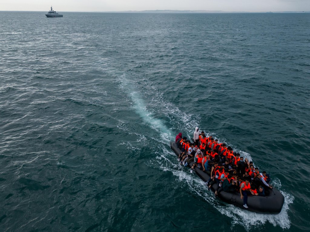 © Reuters - Chris J Ratcliffe | An inflatable dinghy carrying migrants makes its way towards England in the English Channel on 6 August, 2024.