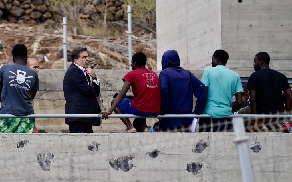 European Commission vice President Margaritis Schinas seen talking to young migrants on Tenerife on Wednesday (September 18) | Source: X page @MargSchinas