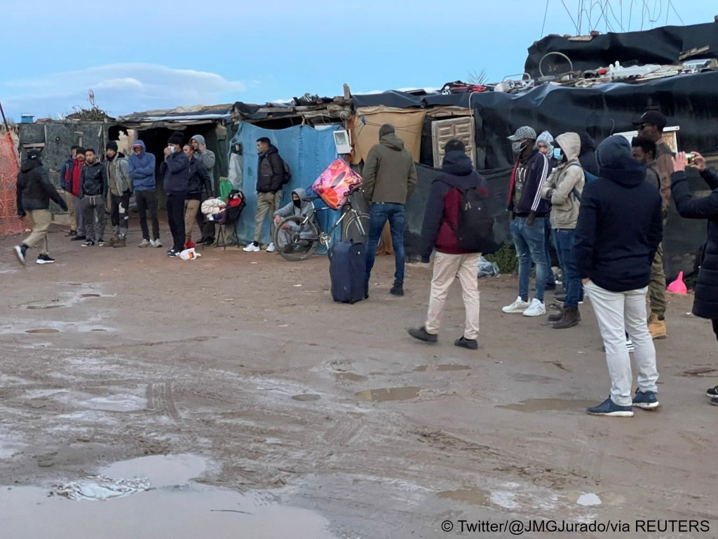 People are evacuated after a fire broke out, at El Walili migrant camp, in Almeria, Spain, January 30, 2023 in this image obtained from social media. Twitter/@JMGJurado/via REUTERS