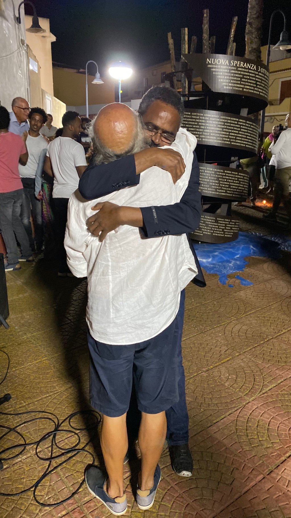 Some of those who survived the 2013 shipwreck return every year for the memorial and to hug Vito Fiorino who helped save them | Photo: Private