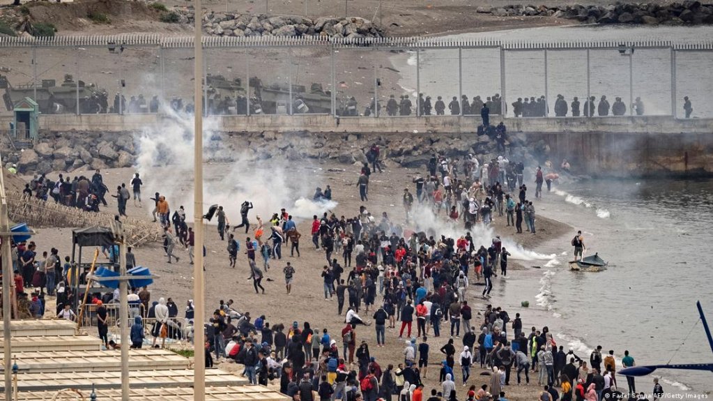 Spanish border agents use tear gas to repel migrants in May 2021. | Photo: Fadel Senna/AFP/Getty Images
