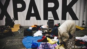Asylum seeker sorting through trash in London
