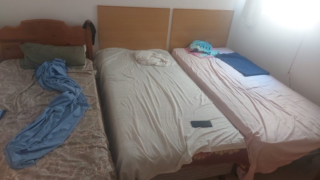 The room where Charly sleeps, with two other asylum seekers.  Credit: DR