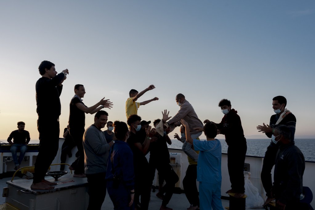 Some of the 145 on board the Sea-Watch 4 celebrate after hearing they have been assigned a port in which to disembark | Source: Twitter feed @Seawatch_Intl