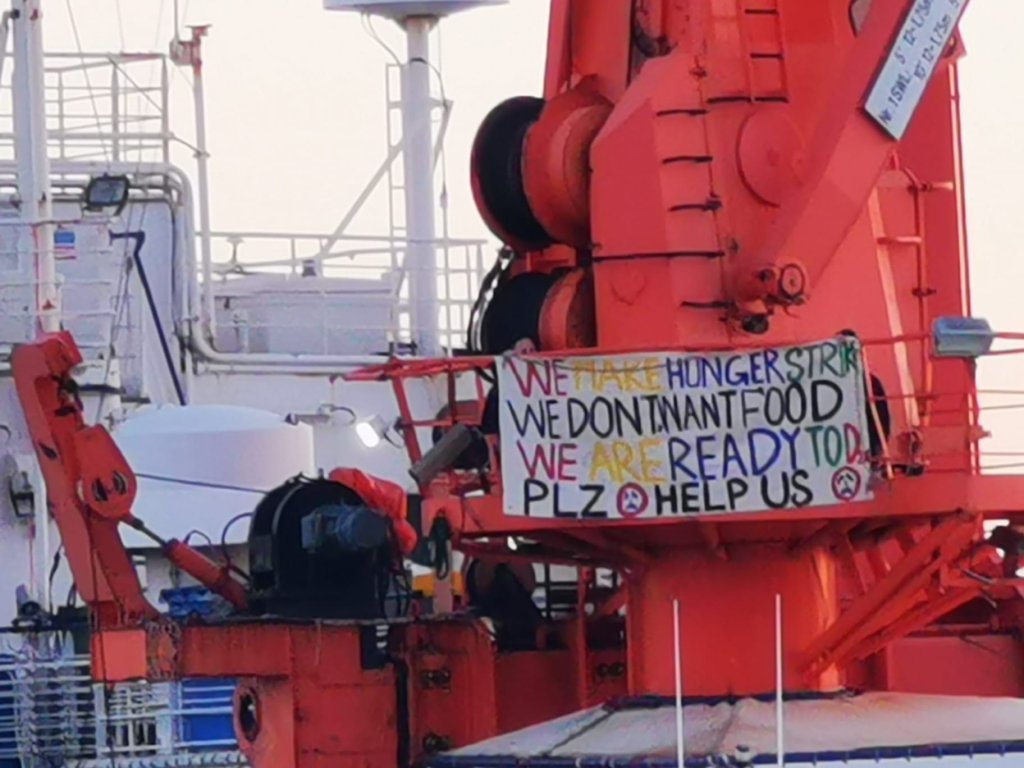 Migrants post banners on board the rescue ships asking for help as they wait to be allowed to disembark in November 2022 | Photo: Alessandro Puglia / InfoMigrants