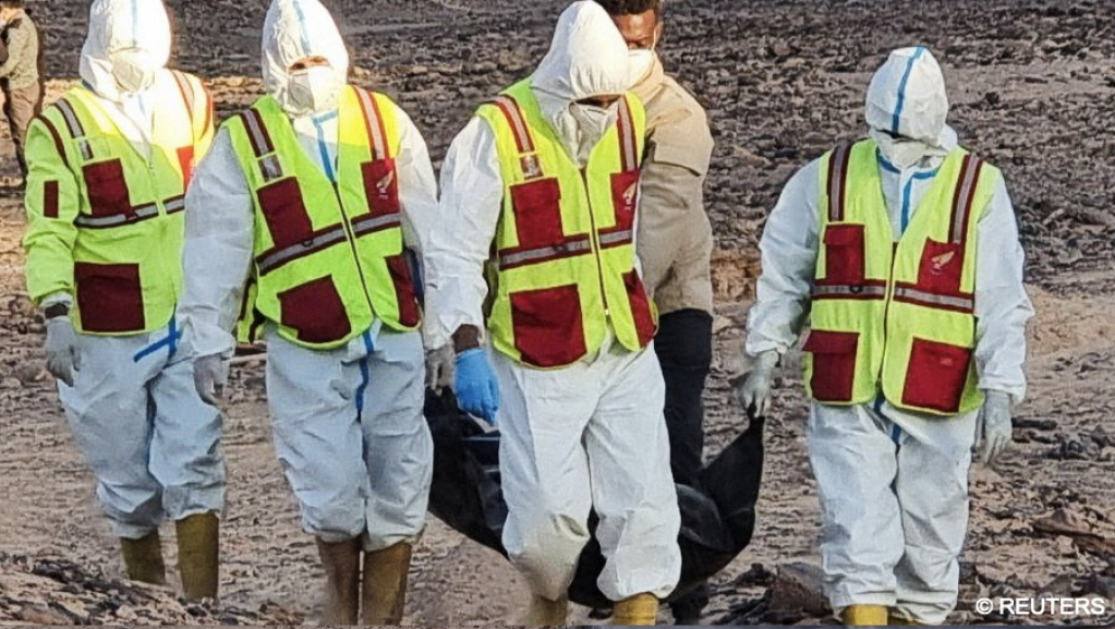 Members of the ambulance and emergency services and security forces recover the bodies
of migrants after they were discovered in a mass grave north of Kufra city, Libya February 13, 2025.